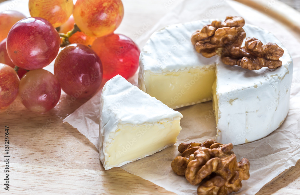 Camembert cheese with walnuts and grape