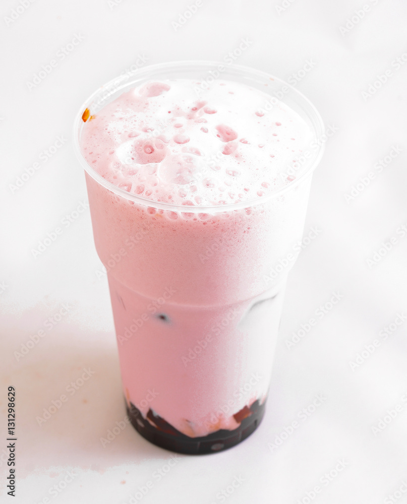 Fresh milkshake with strawberry flavor with the addition of chocolate on a white background Fresh milkshake with strawberry flavor with the addition of chocolate on a white background
