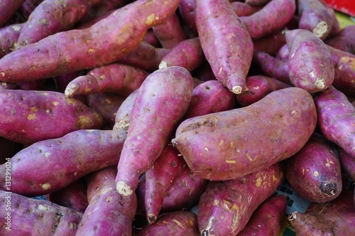 Japanese red sweet potatoes (yams) in bulk at the farmers market
