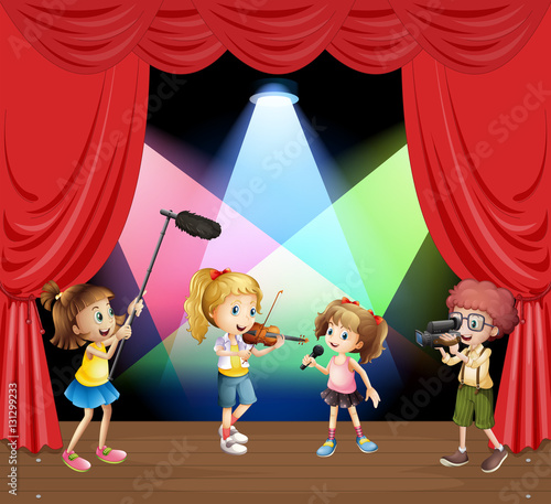 Kids performaning music on stage