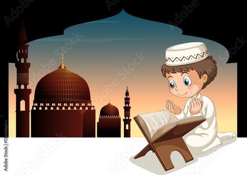Muslim boy praying with mosque background