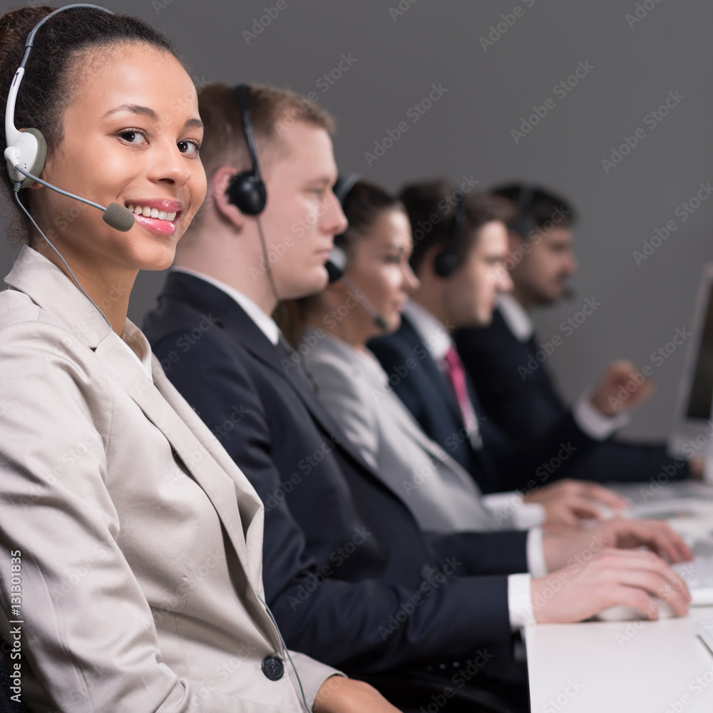 Call center agent with colleagues Call center agent with colleagues