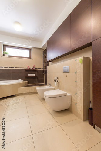 Modern bathroom with beige tiles