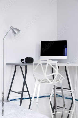 White room with a gap chair