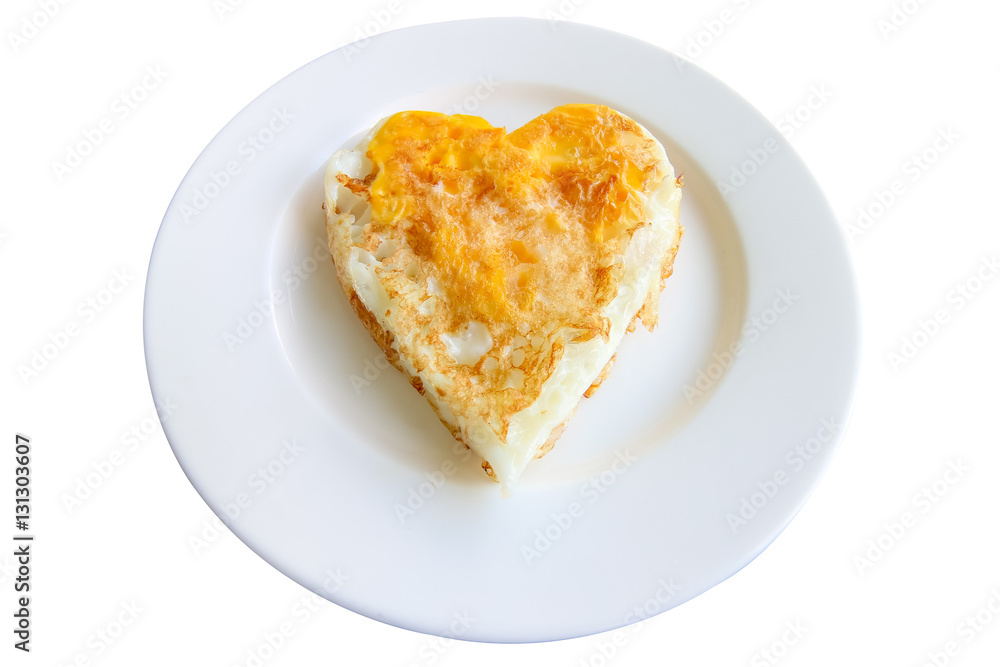 Isolated fried eggs in ideal heart on the white plate on white background