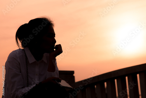 Women on sad concept in the sunset