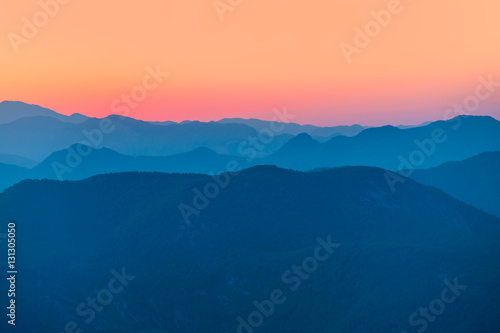 Landscape with blue mountains at sunset