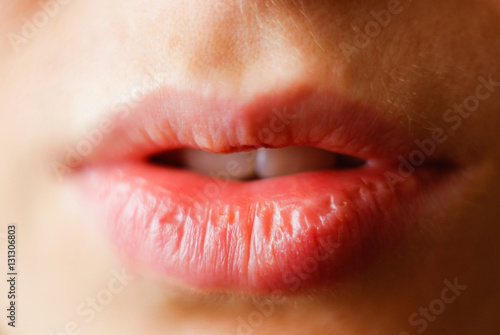 Natural lips. Close up shoot of young beautiful girl. Lips without make-up.