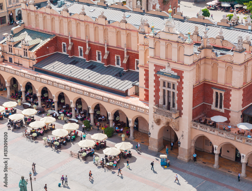 Obraz premium Aerial view on the central square and Sukiennice in Krakow. Market Square from the tower of the church of St. Mary. Poland. Cloth Hall.