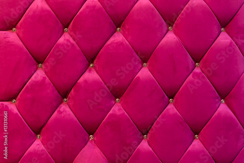 background of shocking pink velvet sofa with crystal button photo