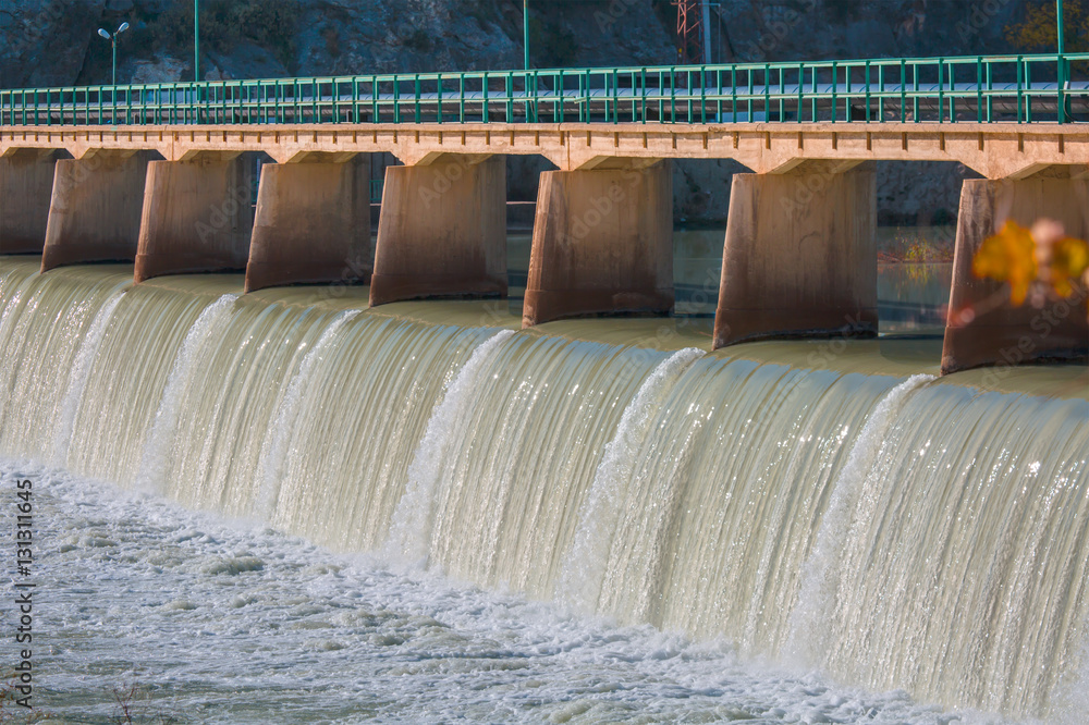 Ταπετσαρία Strong stream of water at the hydroelectric dam