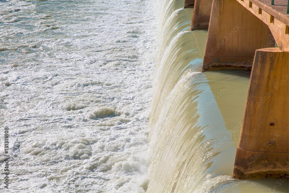 Strong stream of water at the hydroelectric dam Strong stream of water at the hydroelectric dam
