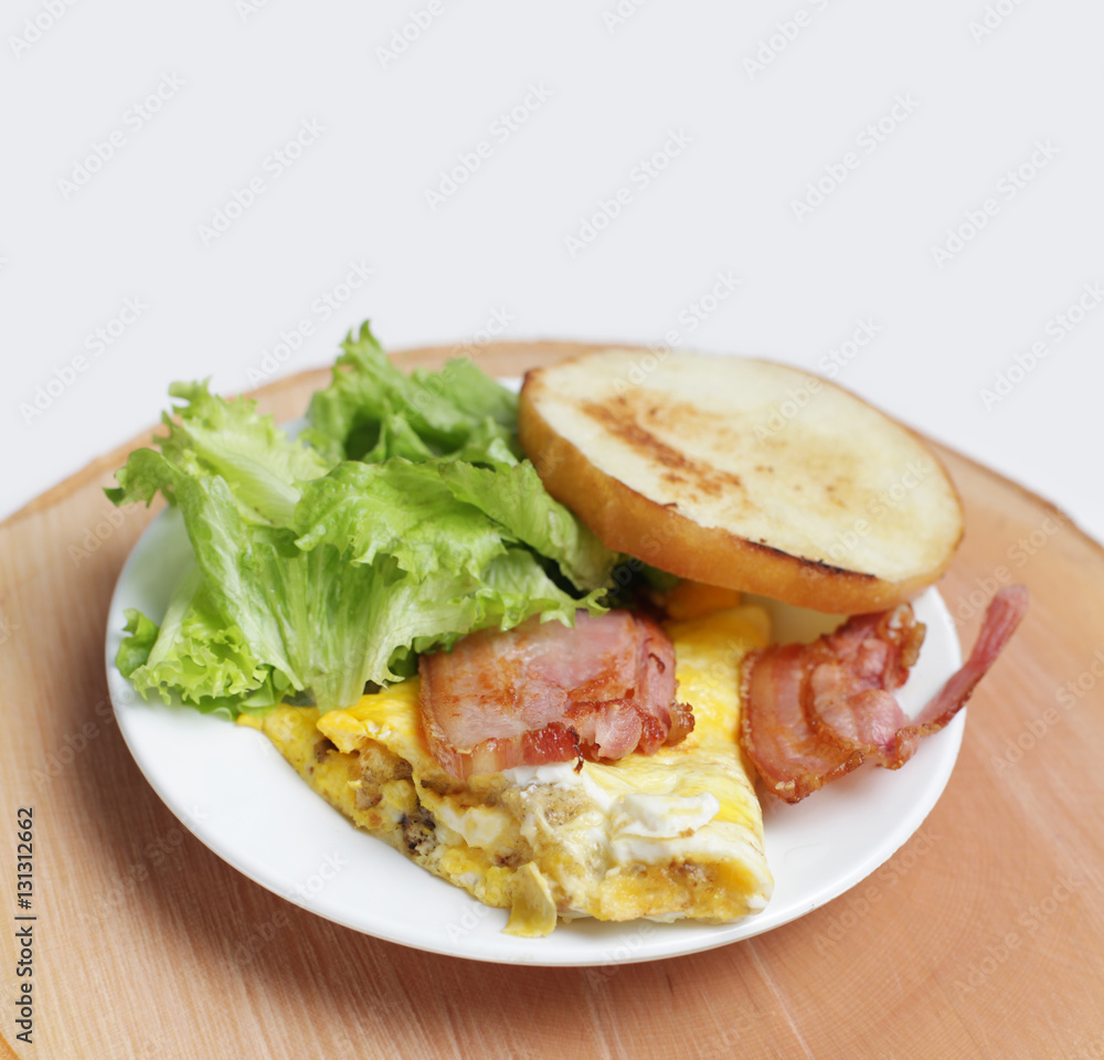 Omelet with bacon and toast.