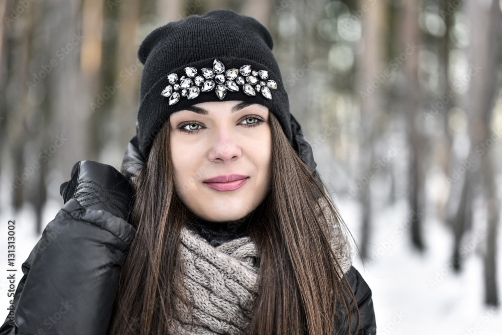 Girl with dark long hair in the winter park Girl with dark long hair in the winter park