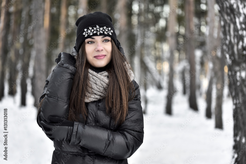 Girl with dark long hair in the winter park Girl with dark long hair in the winter park