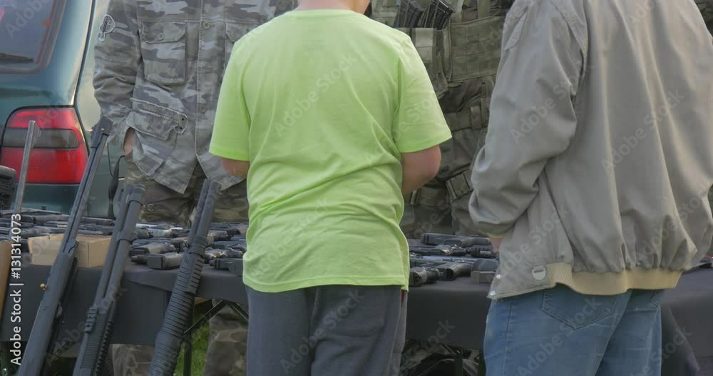 Thick Boy Has Come on an Exhibition of Fire-Arms With a Father Thick Boy Has Come on an Exhibition of Fire-Arms With a Father