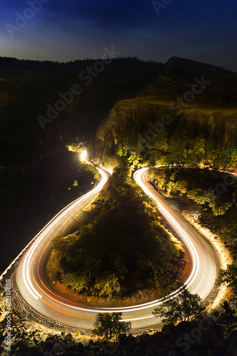 Horseshoe roadway at night with light trails in Rowena Crest, Oregon. photo