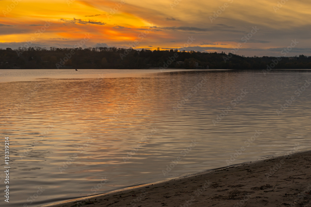 Sunset over beach located on Dnepr river in center of Zaporizhia city at fall season
