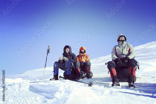 Winter hiking in the mountains on snowshoes with a backpack and © vetal1983