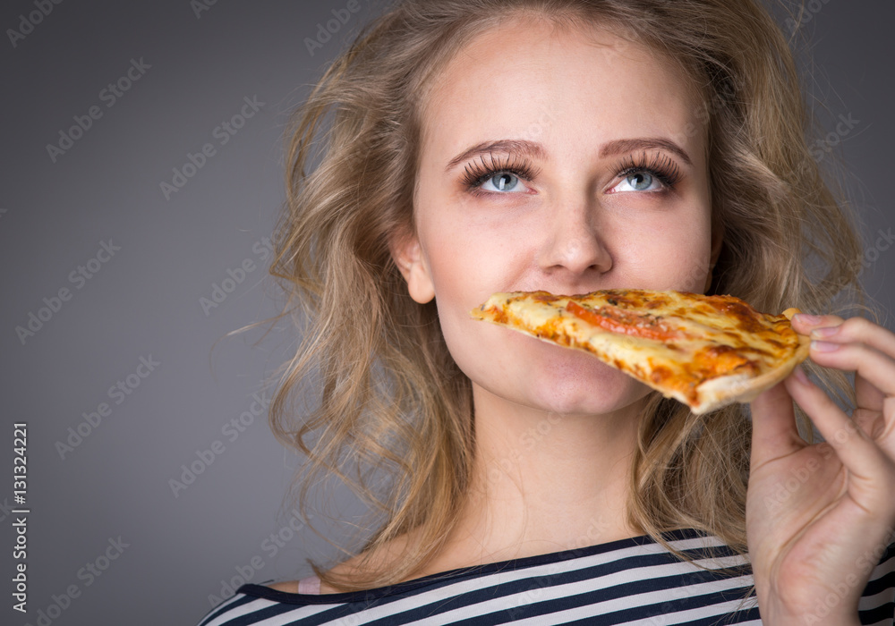 Young woman with a piece of pizza Young woman with a piece of pizza