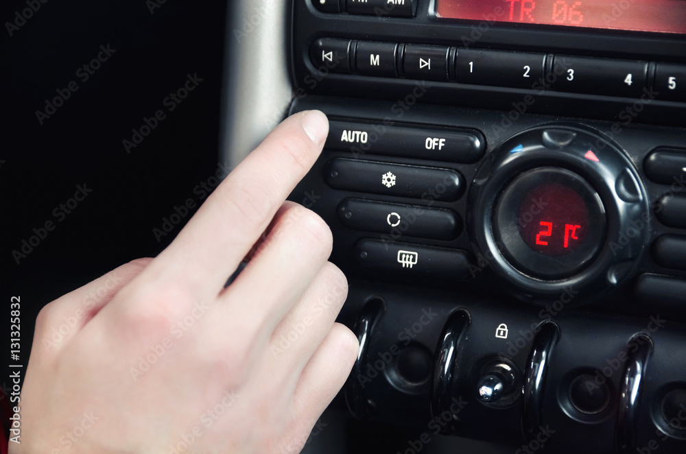 Fototapeta premium Closeup inside vehicle of hand button