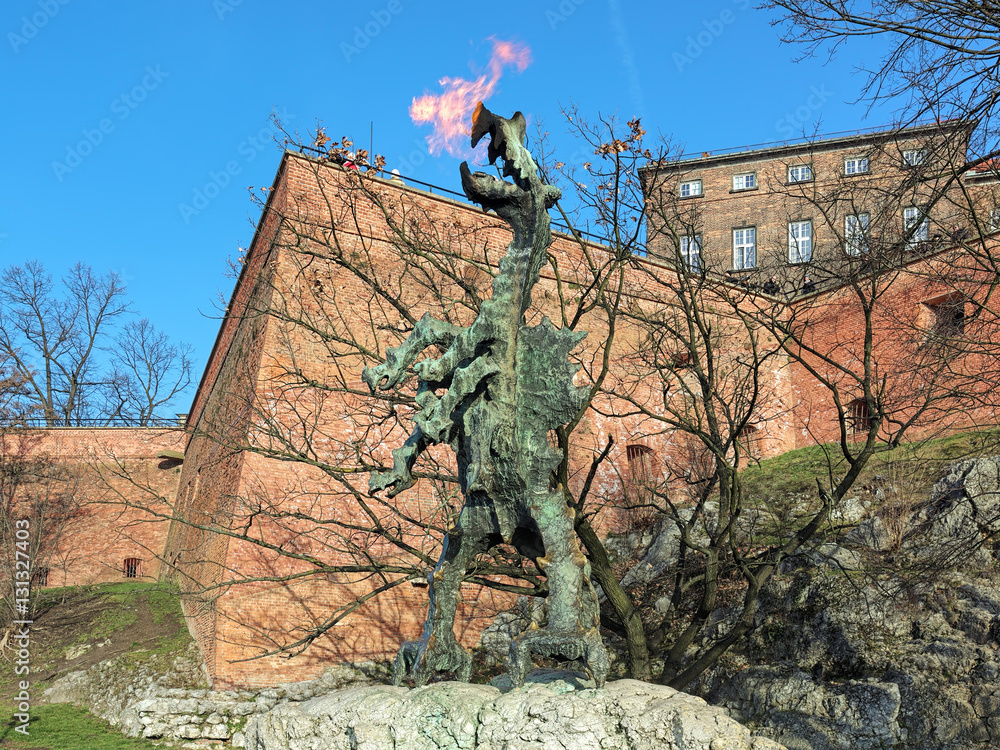 Wawel Dragon Statue breathing fire at the foot of the Wawel Hill in Krakow, Poland