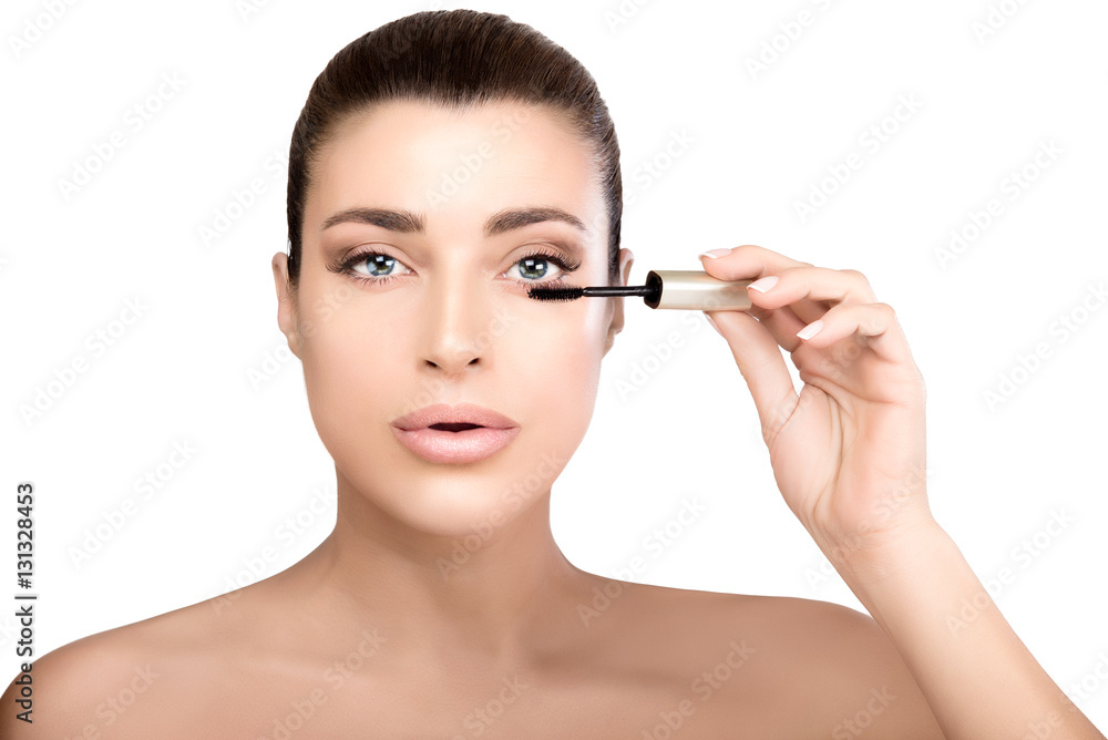 Beauty model young woman applying mascara Beauty model young woman applying mascara