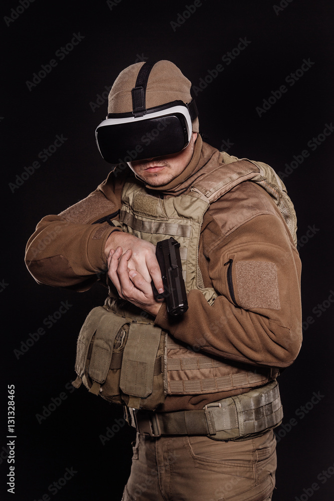 Fototapeta premium Portrait soldier or private military contractor holding rifle.