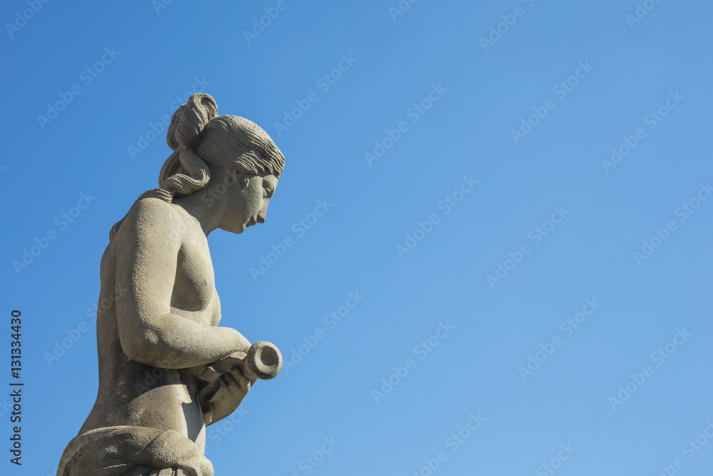 Statue of a naked woman with neoclassic style at Catalonia Square in Barcelona city, Spain