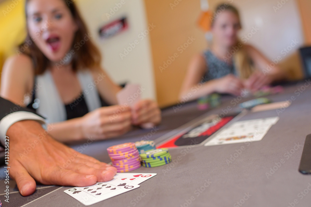 Fototapeta premium Adults around casino table