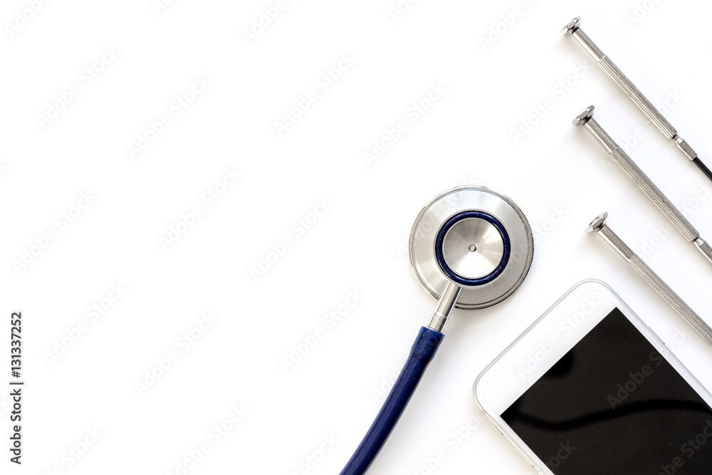diagnostic of gadgets on white background with stethoscope top view diagnostic of gadgets on white background with stethoscope top view