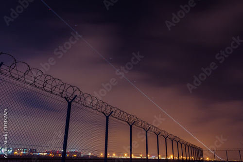 Trail of the starting airliner from airport. 
