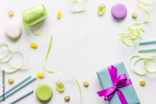 Gift box with colorful party items white background top view