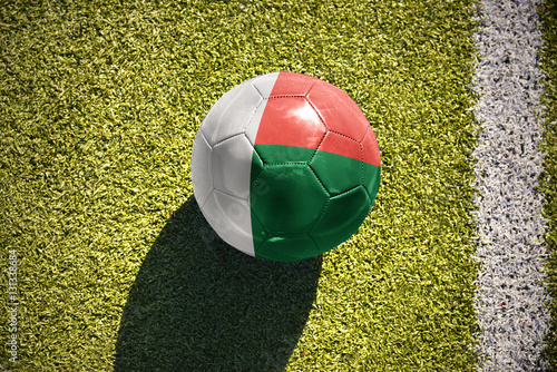 football ball with the national flag of madagascar lies on the field