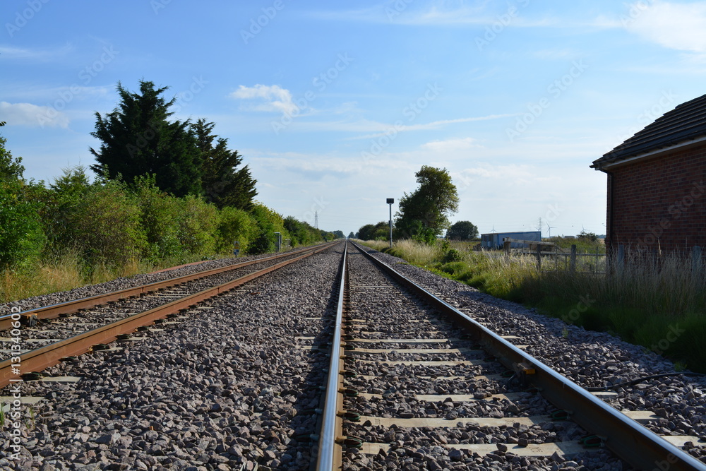 Fototapeta premium Train tracks countryside straight empty