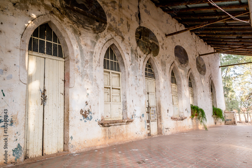 Naklejka premium Horizontal photo in color, perspective and shallow depth of field, about an old white hacienda facade