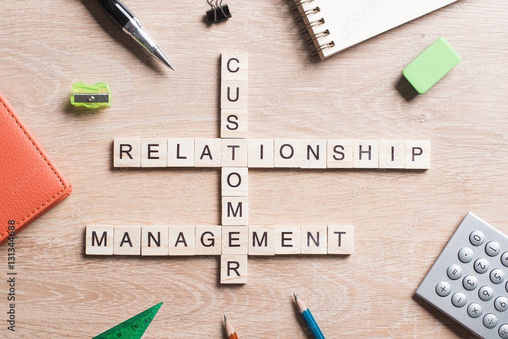 Conceptual business keywords on table with elements of game making crossword Conceptual business keywords on table with elements of game making crossword