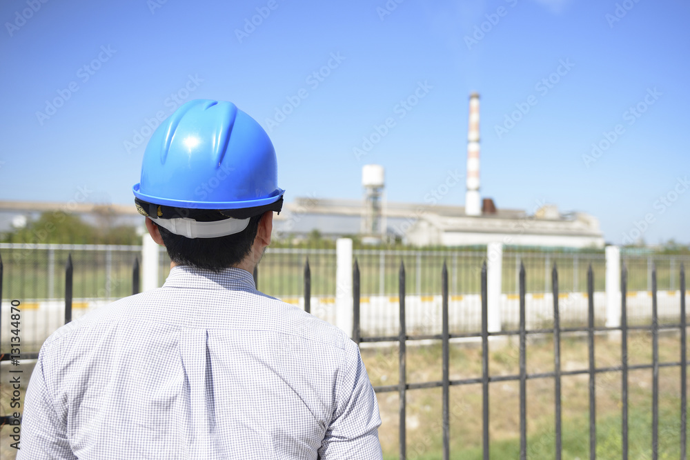 The Engineer looking into the factory from the outside The Engineer looking into the factory from the outside