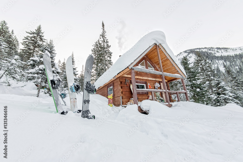 Snowboard at house chalets in winter forest with snow in mountai