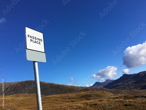 A Passing Place sign in the historic pass through the Applecross Peninsula, Wester Ross, Highland Region, Scotland, UK. 