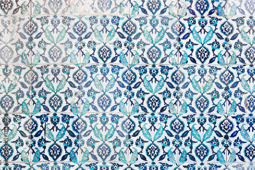Seamless pattern white Turkish tiles with blue ornaments. Old su