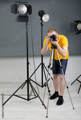 Handsome photographer with ...