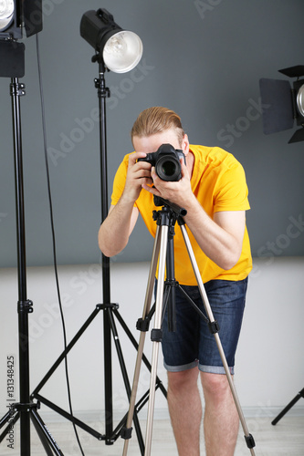 Handsome photographer with ...