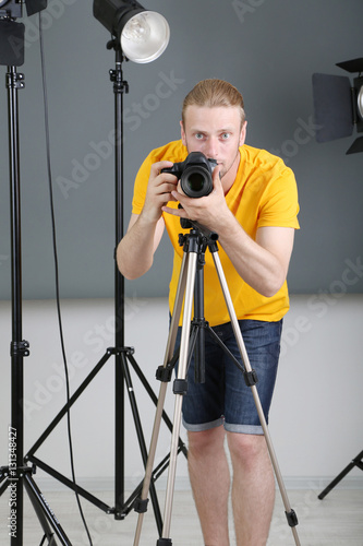 Handsome photographer with ...