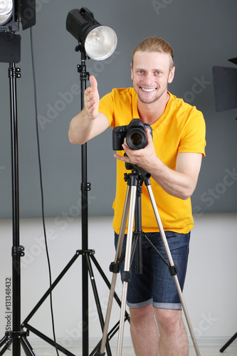 Handsome photographer with ...