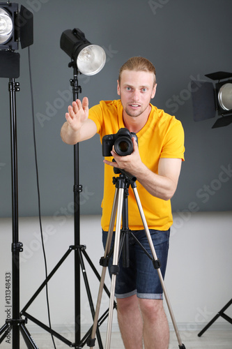 Handsome photographer with ...