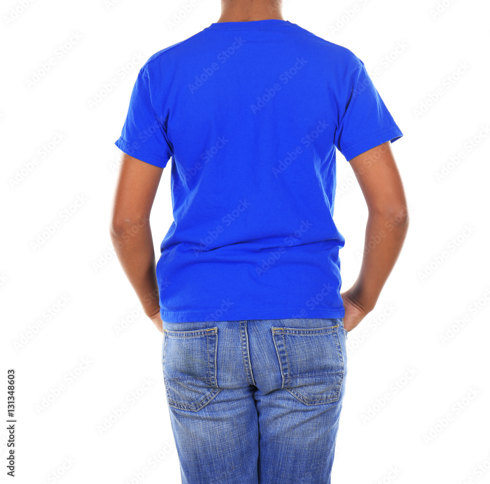 Young African American boy in blank blue t-shirt standing on white background Young African American boy in blank blue t-shirt standing on white background