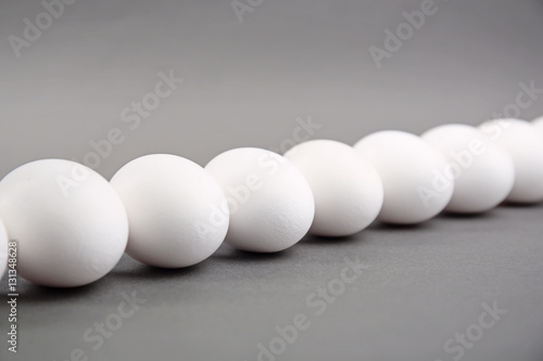 White eggs on grey background