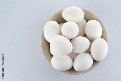 Bowl of eggs isolated on white