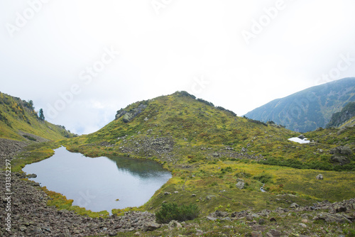 Beautiful mountain lake surrounded by impressive mountains of th